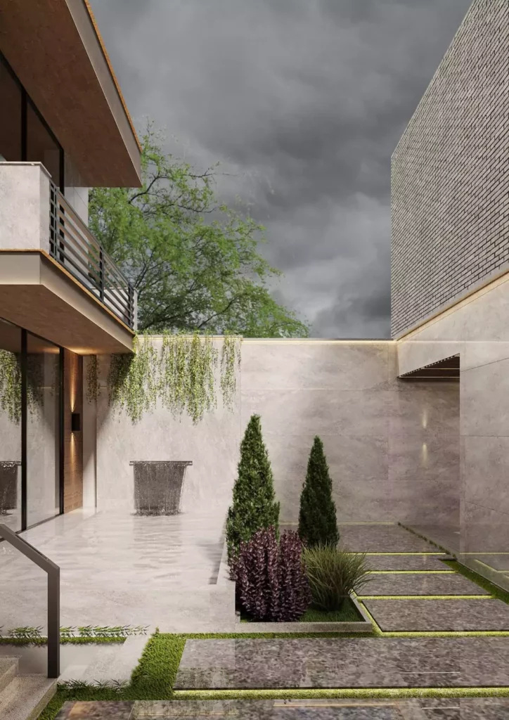 Cour intérieure minérale, façade de brique et jardin, architecture Sevid Build