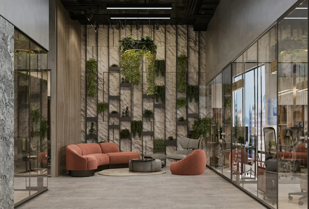 Espace détente de bureaux avec mur végétal et canapés arrondis